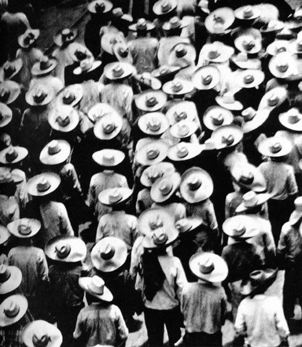 Overhead photo of the crowded street by Tina Modotti