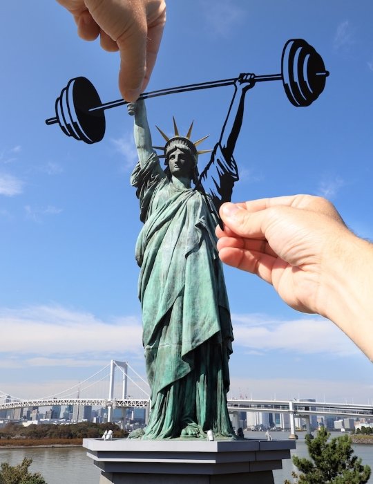 Creative forced perspective example using statue of Liberty