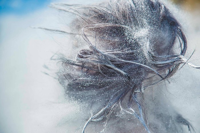 Abstract portrait featuring flying hair and flour - cool texture photography