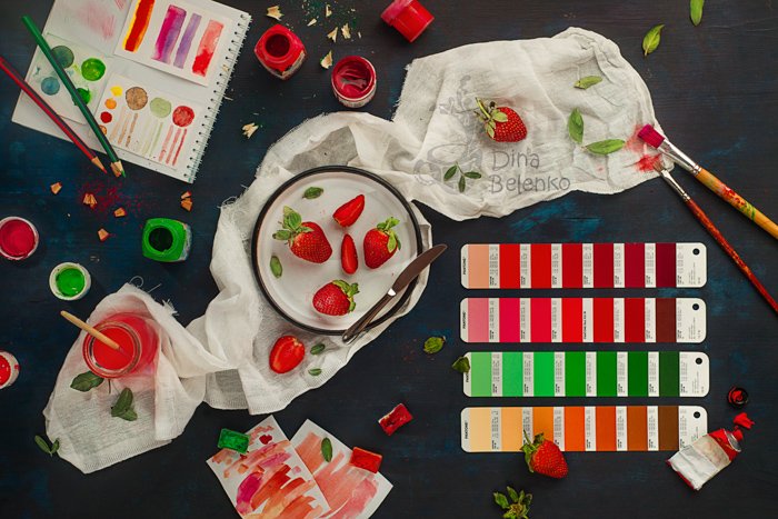 A flat lay photo themeed with red and green complementary colors