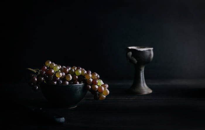 A dark and atmospheric fine art food photography still life