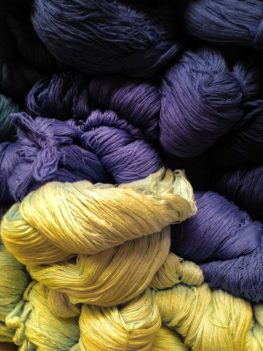 Yellow and purple balls of wool 