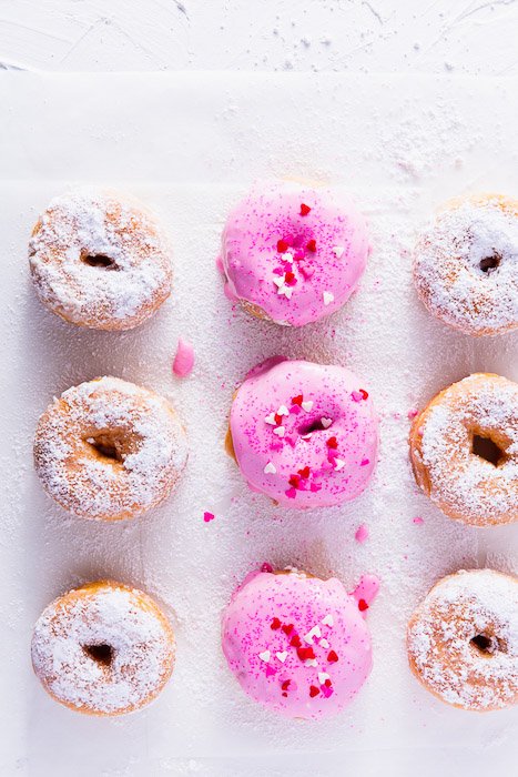 Overhead shot of pink frosted doughnuts