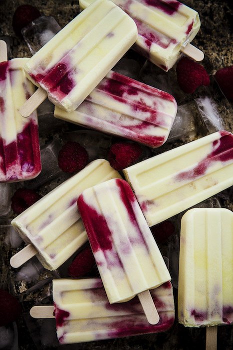 A dark and moody flatlay of ice-lollies