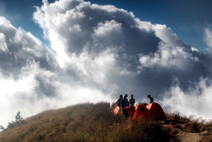 Photographers climbing a volcano on a cloudy day-volcano and lava photography