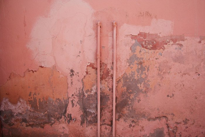 A dirty textured pink wall - photography themes