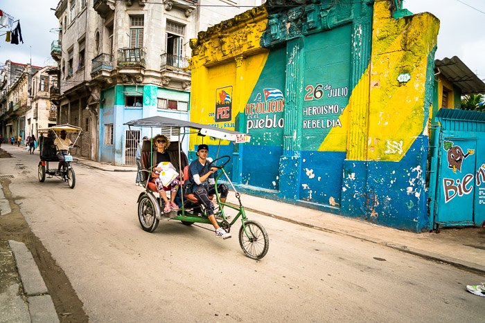 Tuktuk bikes on a dusty street