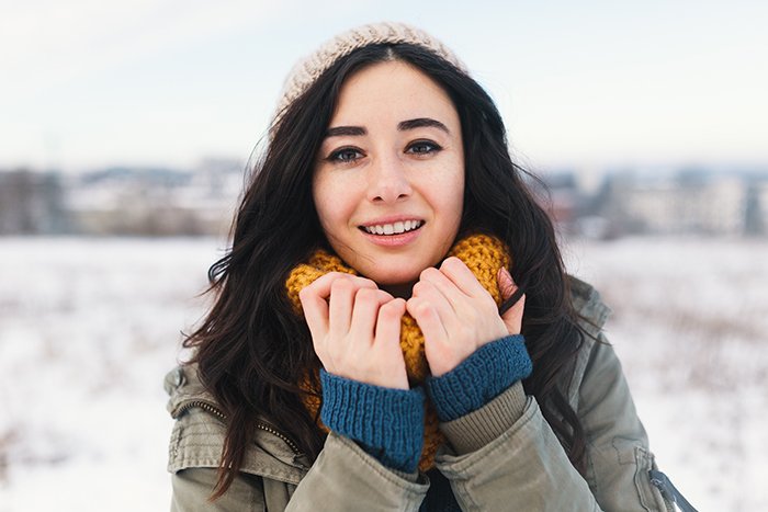 Heart melting winter portrait of pretty young woman.
