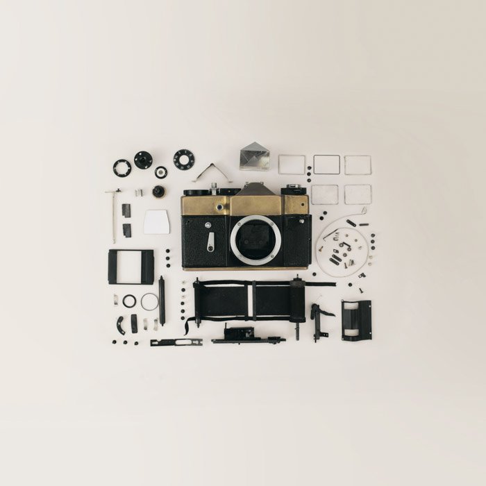 Flay lay photo of film camera and gear